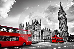 London, the UK. Red buses in motion and Big Ben