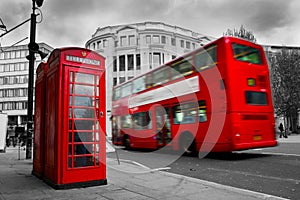 London, the UK. Red phone booth and red bus