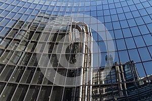 London, UK - September 02, 2018: Reflection of the Lloyd`s Building in London`s financial district. One of most fancy skyscraper