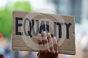 Protesters holding sign at Black Lives Matter protest demonstration in London.