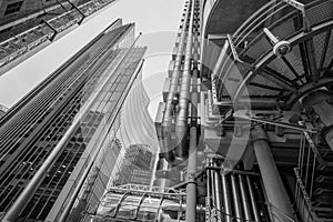 View looking upwards showing the Lloyds of London building designed by Richard Rogers, and the Willis Building by Norman Foster photo