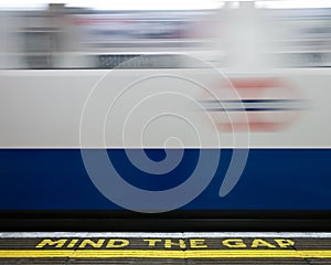 London Underground Mind the Gap sign on station platform