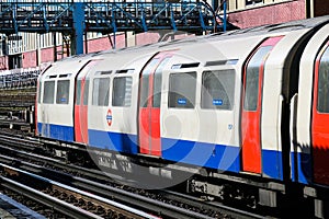 London underground tube train travelling above ground on the Piccadilly Line