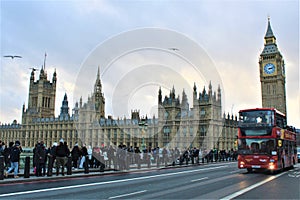 London, United Kingdom - December 2023 - Photo of the double deck bus on the bridge and the Palace of Westminster and Big Ben