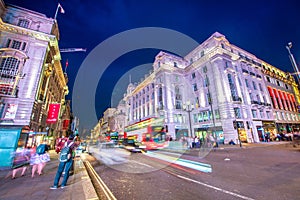 City traffic at night from Piccadilly Circus in London, United Kingdom in long exposure
