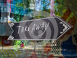 Take Away food sign in shop display window. London lockdown.