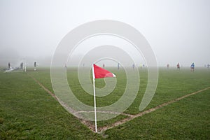 Londoners playing football in low visibility on a foggy day