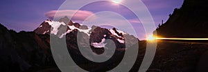 Lone Car Passes on Roadway Full Moon Mt Shuksan