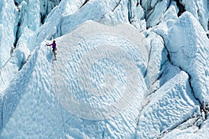 Lone climber reached a top of one iceberg photo