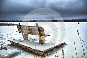 A lone fisherman on a frozen winter lake. Winter fishing