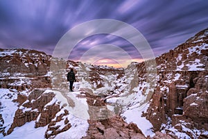 A lone hiker at Cathedral Gorge State Park in the winter