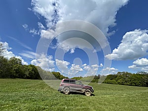 A lone off-road car in beautiful scenery in the hills of Transylvania