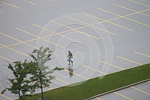 Lone Pedestrian in Empty Wet P