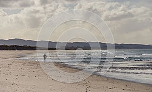 lone runner on bream Bay