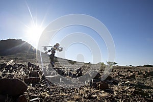 Lone stone man of Kaokoland walking to a gathering. Kunene Region, Namibia.