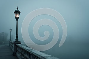 lone streetlamp on bridge with enveloping fog