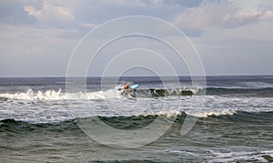 A lone surfer hitting some waves in Florida.