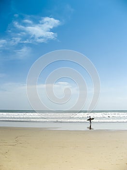 Surfer on kuta beach bali indonesia