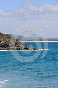 Lone surfer in the water