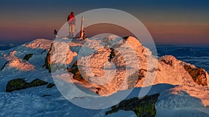 A lone tourist watches from the top of Chopok in the Low Tatras at sunrise