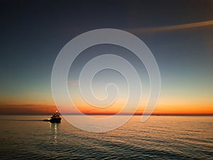 Lone vessel during sunset