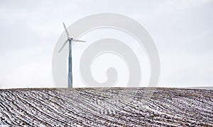 Lone windmill in farmers field