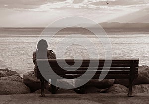 Lone woman on the bench.