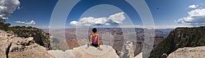 Loneliness woman in Grand Canyon panoramic photo