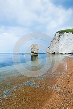 lonelly rock formation at coastline in Dorset