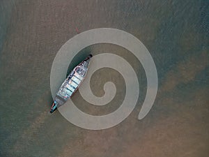 Lonely Abandoned Boat on Shallow Seas