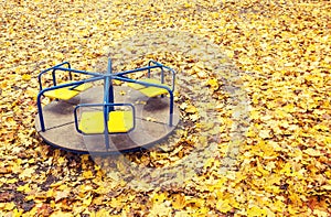 Lonely abandoned carousel at autumn