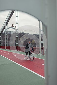lonely adult man riding bicycle