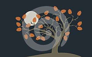 Lonely autumn tree with the moon