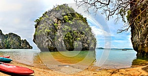 Lonely beach and island, and canoes - Koh Lanta, Krabi, Thailand