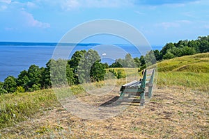 A lonely bench on a mountain with a beautiful view of the Volga River. A place for solitude, meditation, rethinking the meaning of