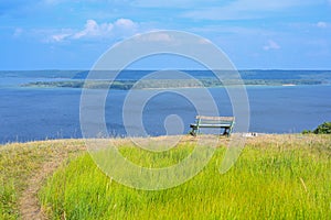 A lonely bench on a mountain with a beautiful view of the Volga River. A place for solitude, meditation, rethinking the meaning of