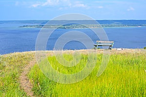 A lonely bench on a mountain with a beautiful view of the Volga River. A place for solitude, meditation, rethinking the meaning of