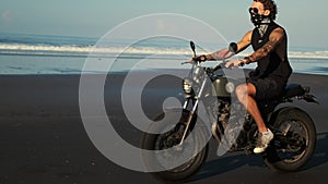 Lonely biker ride along the ocean beach