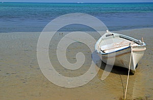 Lonely boat at Aegean Sea coast photo