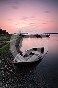 Lonely boat on the bank
