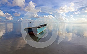 Lonely boat with blue sky