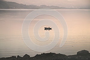 Lonely boat on the evening Roznow lake