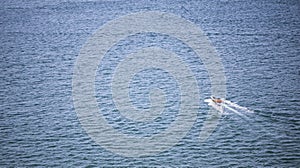 A Lonely boat floating out into the open ocean