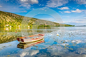 a lonely boat on lake orestiada/kastoria in Greece