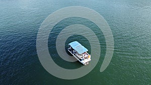 lonely boat in the middle of the calm sea