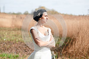 The lonely bride with flowers in a hairstyle