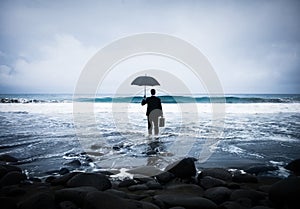 Lonely Businessman Alone in the Beach photo