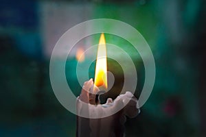 Lonely candle on a blurred background