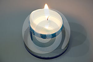 Lonely candle in a candlestick