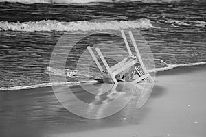 Lonely chair on the beach of Maayan Zvi